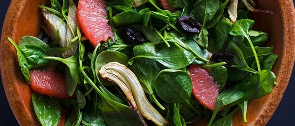 Spinach salad with roasted fennel, oil-cured olives, and grapefruit