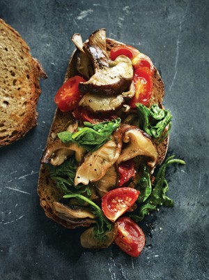 Spinach, tomato and shiitake mushrooms on toast