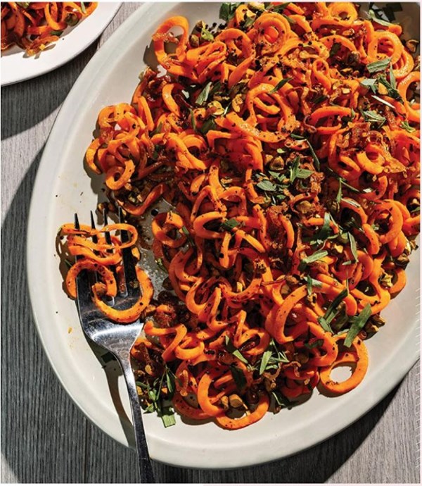 Spiralized sweet potatoes with crispy shallots, pistachios, and Urfa