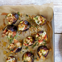 Split figs, stuffed with Taleggio, walnuts, thyme and honey
