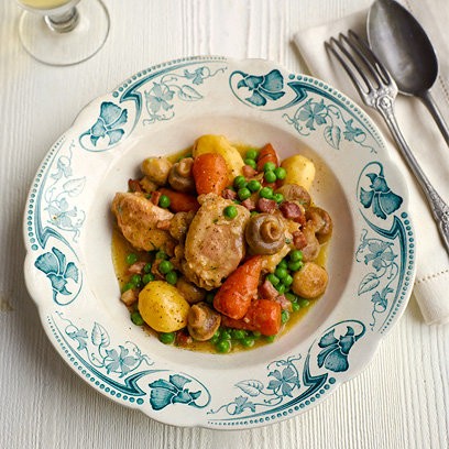 Spring chicken stew with carrots and peas