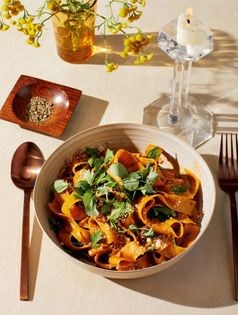 Spring lamb ragù with anchovies and pea shoots