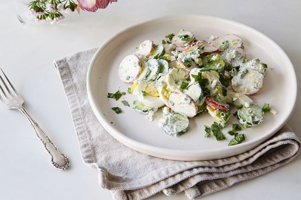 Spring radishes salad in a sour cream and yogurt sauce