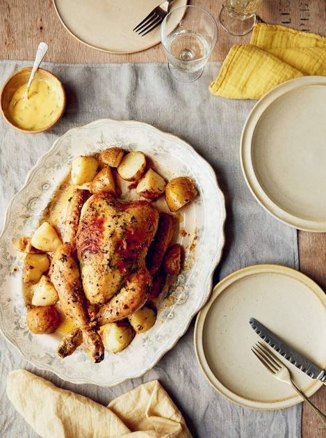 Spring roast chicken with wild garlic, herbs, roast new potatoes and tarragon mayo