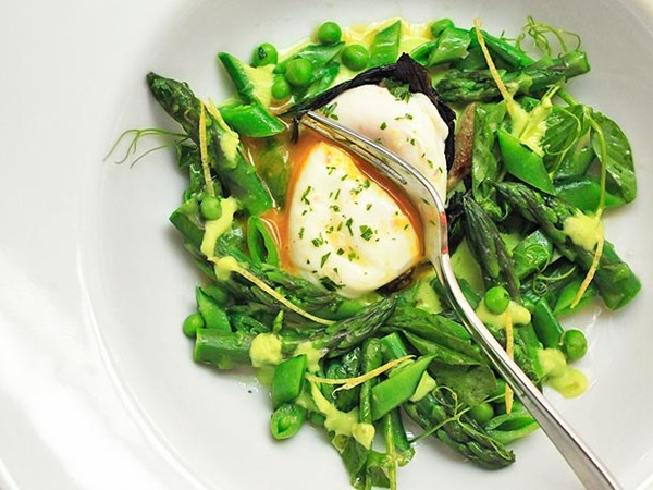 Spring salad of asparagus, ramps, snap peas, and peas, with poached egg and lemon zest vinaigrette
