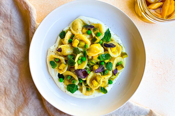 Spring vegetable pasta with whipped ricotta & garlic confit