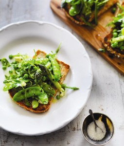 Spring vegetable tartine with goat's cheese on toasted grain bread