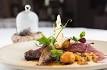 Squab pigeon, pearl barley and truffle risotto, foie gras, hay-smoked offal brochette