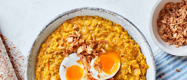 Squash and coconut dal with jammy eggs and crispy onions