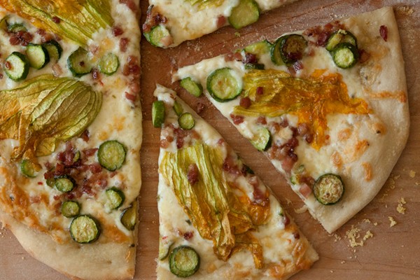 Squash blossom and pancetta pizza