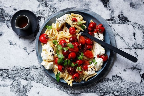 Squashed tomato & black garlic labneh pasta salad