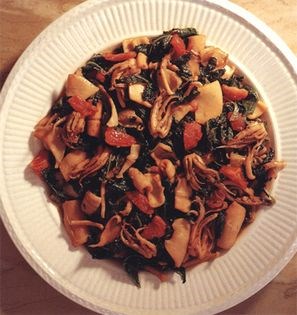Squid braised in olive oil and white wine with spinach, fresh tomato and chilli peppers