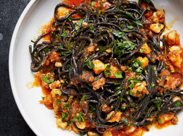 Squid ink pasta with shrimp, nduja, and tomato