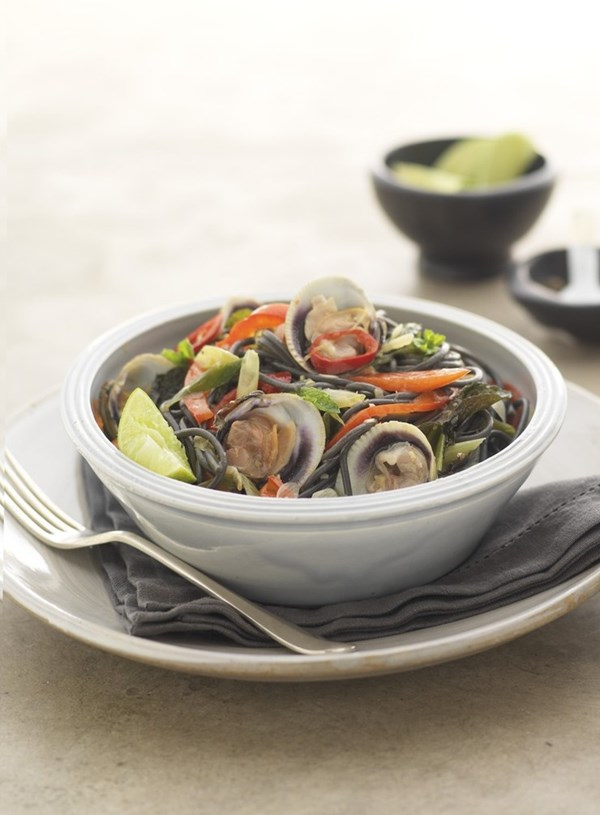 Squid ink spaghetti with clams, lemongrass, lime and mint