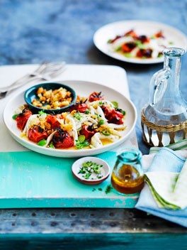 Squid with roast tomato dressing, Sicilian olives and garlic crumbs
