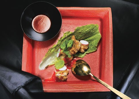 Sriracha-soy fried chicken in lettuce leaves