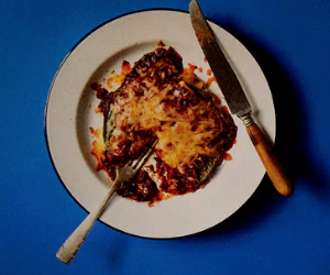 Stacked blue corn tortillas with red chilli sauce