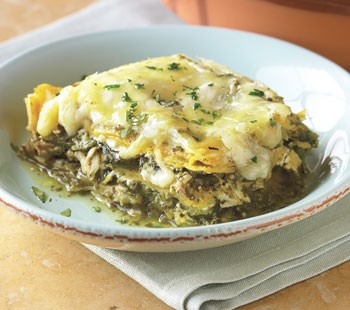 Stacked chicken enchiladas with salsa verde and cheese