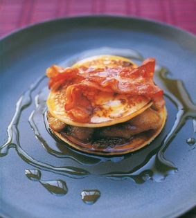Stacked potato blintzes with bacon and bananas