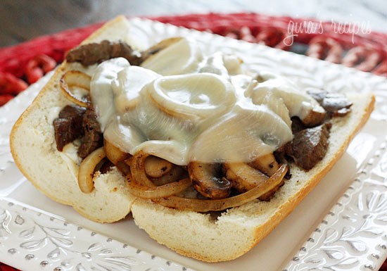 Steak and cheese sandwiches with onions and mushrooms
