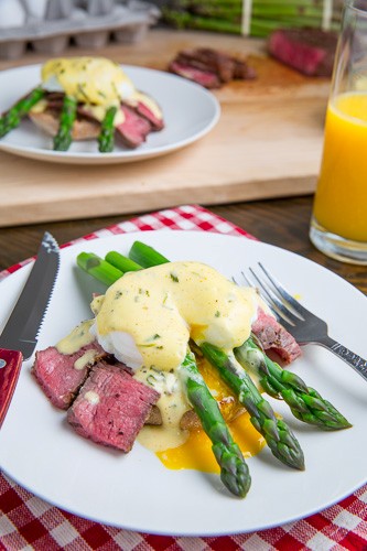 Steak and eggs Benedict with asparagus in Bearnaise sauce