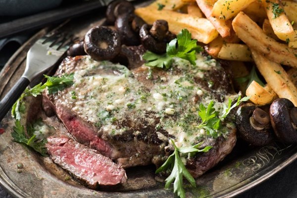 Steak and fries with pickled onions