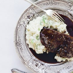 Steak and gravy with sour cream and parsnip puree