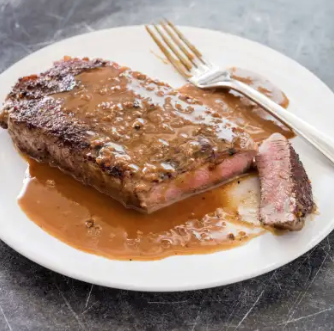 Steak au poivre with brandied cream sauce
