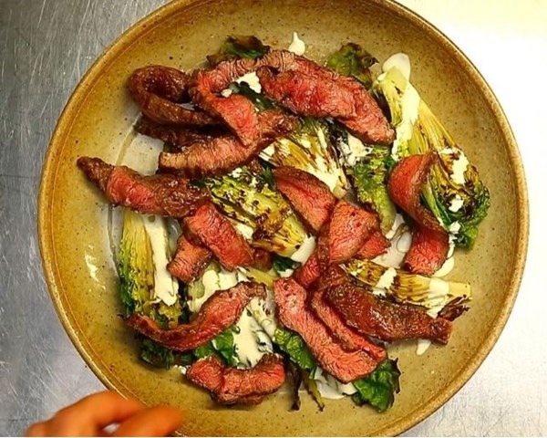Steak, grilled lettuce and blue cheese dressing