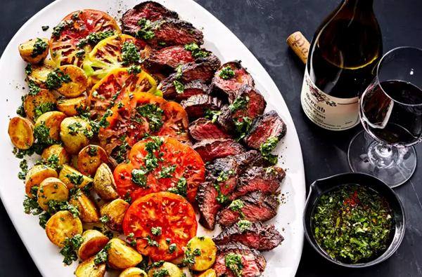 Steak, potatoes, and tomatoes with quick chimichurri