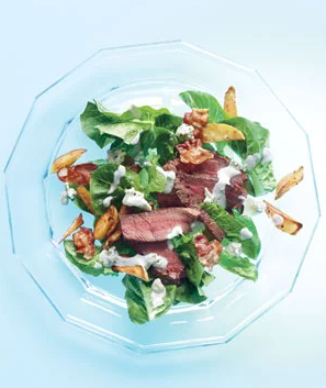 Steak salad with bacon, potatoes, and blue cheese dressing