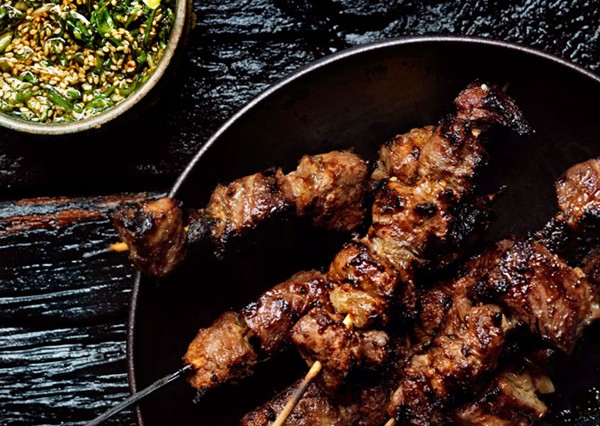 Steak skewers with scallion dipping sauce