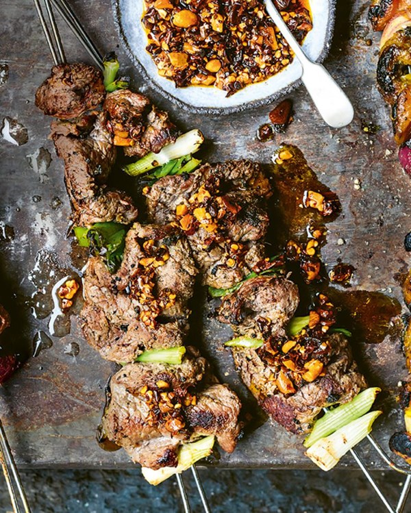 Steak, spring onion and ginger skewers with chilli peanut oil