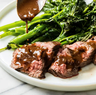 Steak tips with red wine-shallot sauce and broccoli rabe