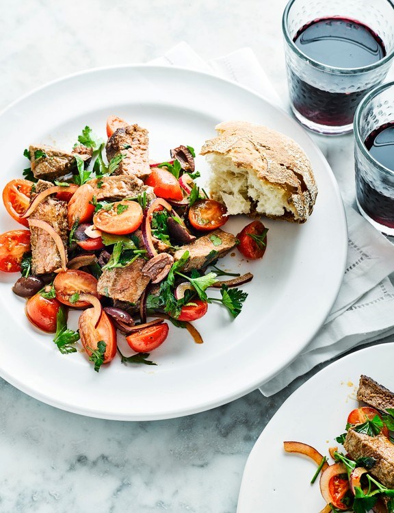Steak, tomato and olive salad