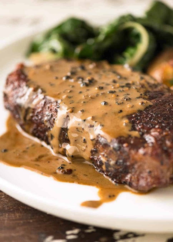 Steak with creamy peppercorn sauce