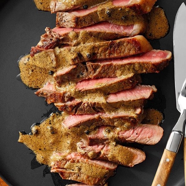 Steak with creamy peppercorn sauce