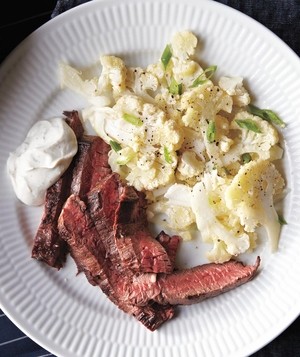 Steak with cumin-lime yogurt and cauliflower salad