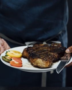 Steak with orange peel and coriander