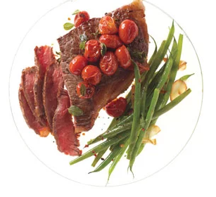Steak with skillet tomatoes and spicy green beans