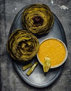 Steamed artichokes with cashew red pepper dip