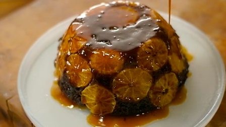 Steamed chocolate and clementine sponge with orange sauce