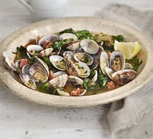 Steamed clams in saffron & spring green broth 