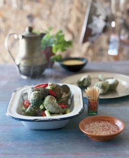 Steamed cockles or periwinkles (Ôc luôc)