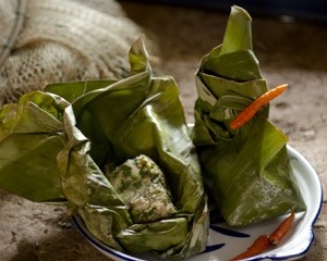 Steamed fish in banana leaves