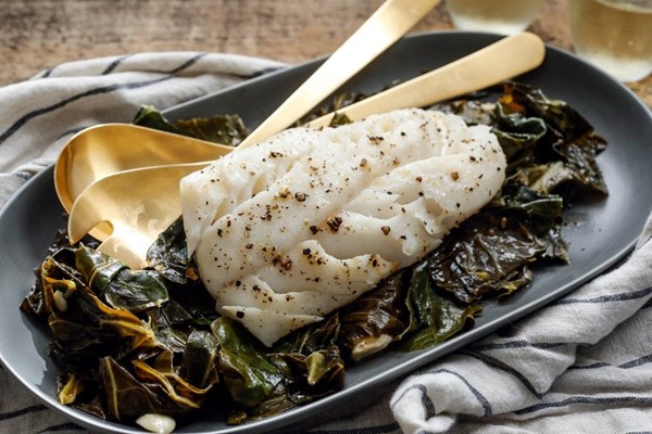 Steamed fish on kale
