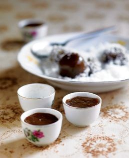 Steamed gula melaka and rice flour cake served with grated coconut (Kueh ko swee)