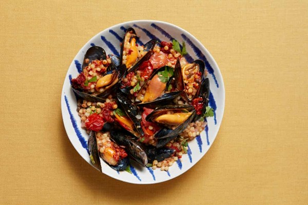 Steamed mussels with fregola, 'nduja and baby tomatoes