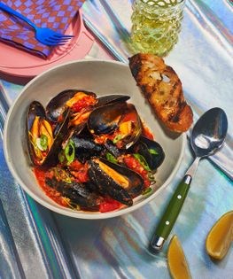 Steamed mussels with tomato chili crisp broth