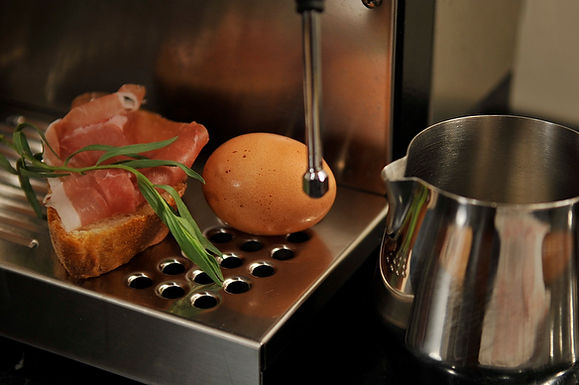 Steamed scrambled eggs with prosciutto breadcrumbs and tarragon